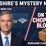 Greg Abel, new CEO of Berkshire Hathaway, reviewing financial documents with charts showing major stock holdings like Apple and Bank of America.